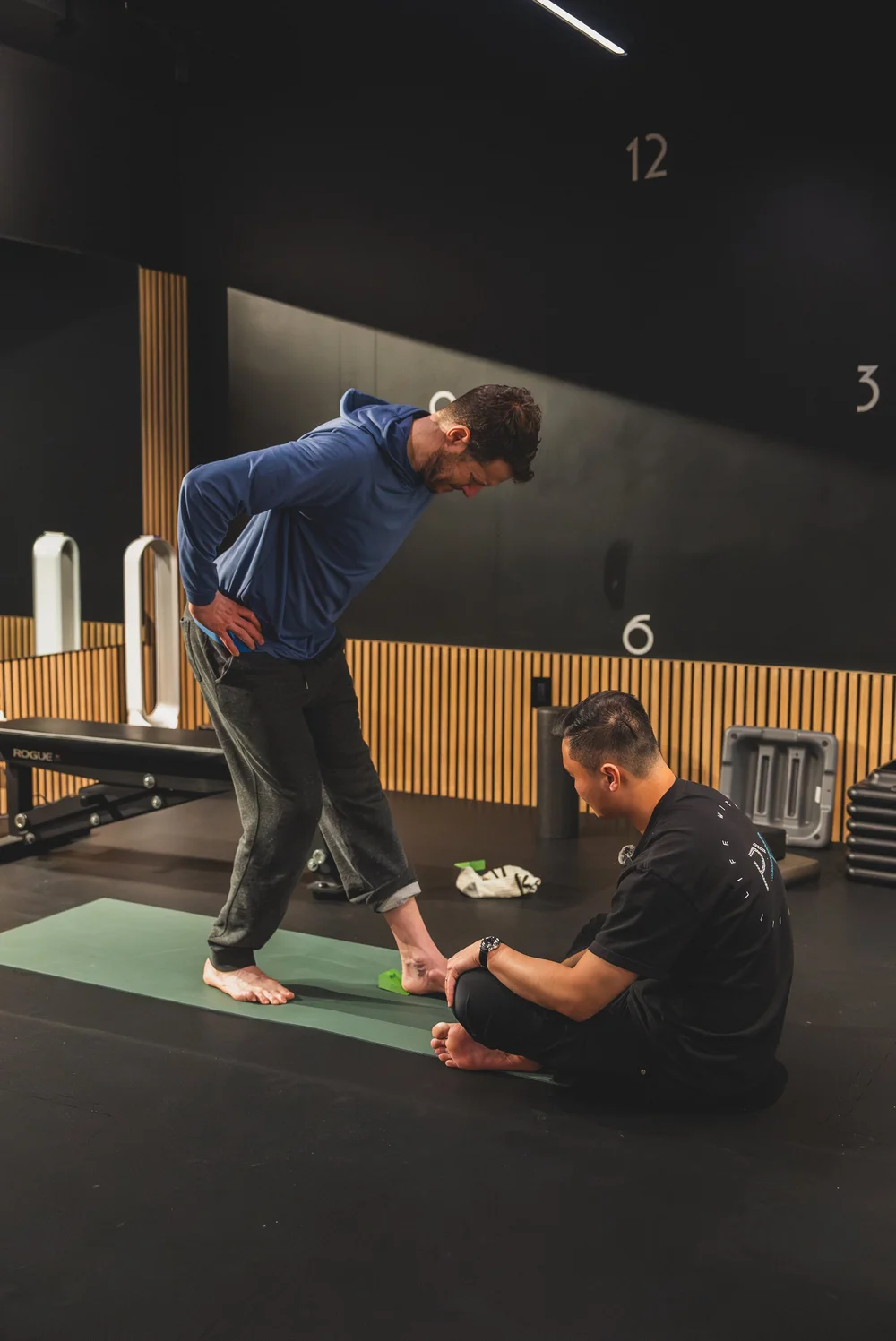 Physical therapist evaluating a client during a one-on-one session