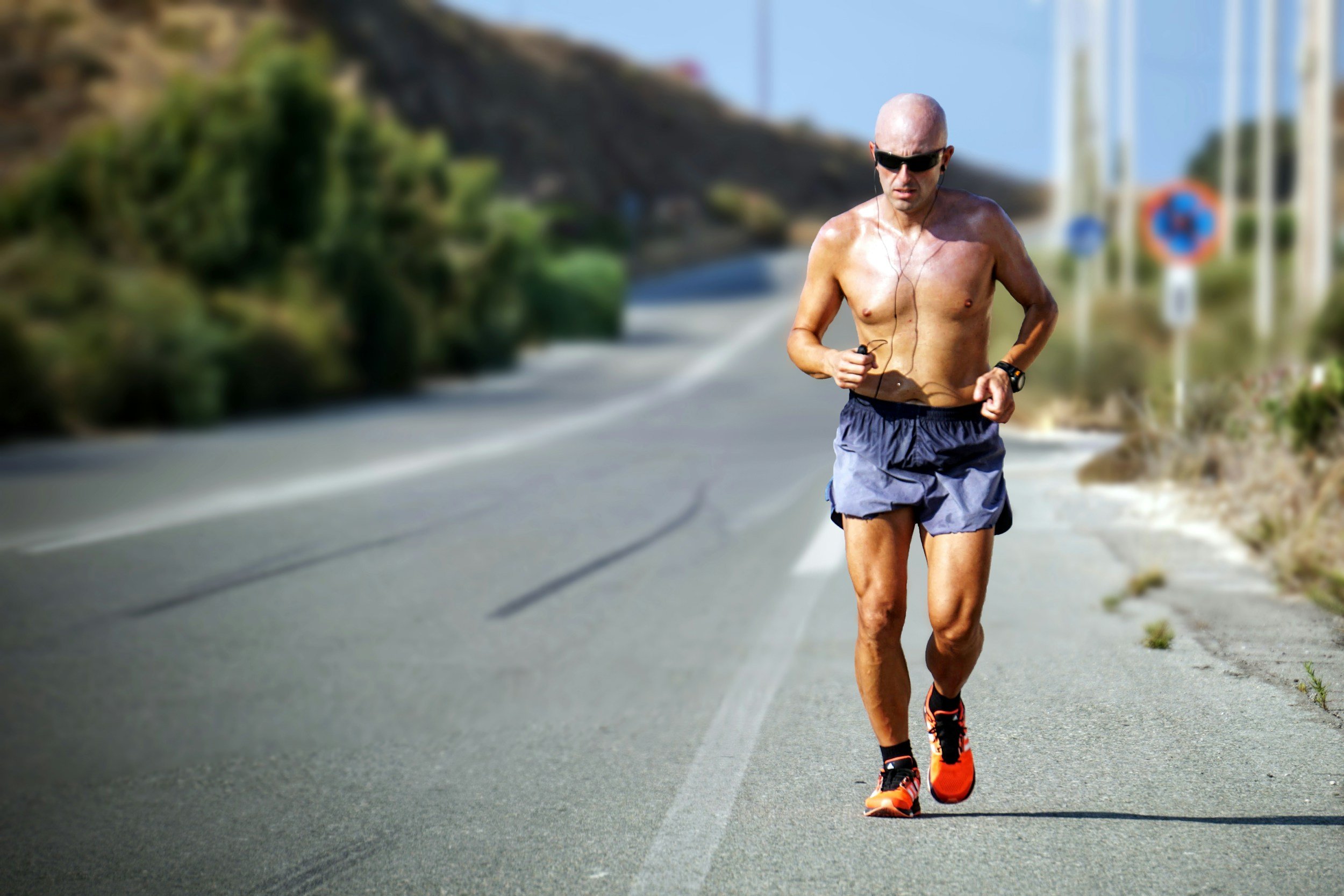 Runner clutching knee in pain
